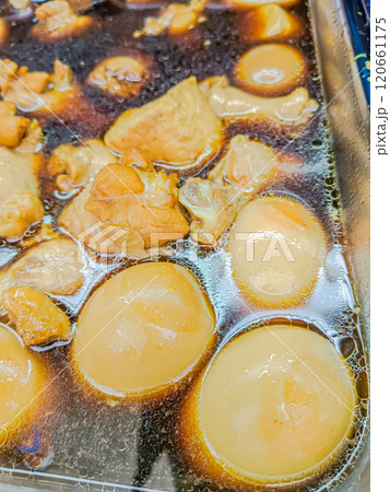 Egg and pork in sweet brown sauce. 120661175