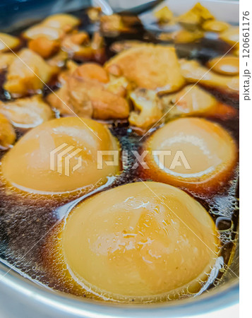 Egg and pork in sweet brown sauce. Egg and pork in sweet brown sauce. 120661176