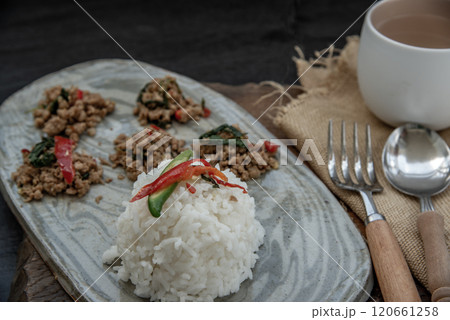 Stir fried Thai basil with minced pork and basil served with steamed rice. Popular traditional food of Thailand. look delicious. Stir fried Thai basil with minced pork and basil served with steamed rice. Popular traditional food of Thailand. look delicious. 120661258