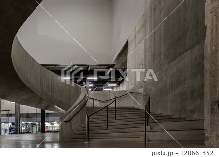 A curving flight concrete spiral staircase at Blavatnik Building of Tate Modern Switch House extension. A curving flight concrete spiral staircase at Blavatnik Building of Tate Modern Switch House extension. 120661352