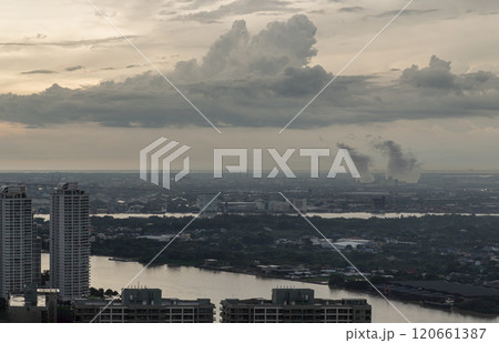 Aerial view of Bangkok city and beautiful clouds in sky background with the Chao Phraya River before sunset. 120661387