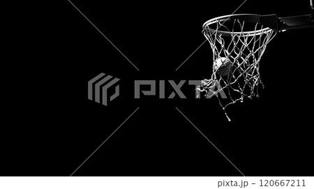 Basketball going through the net on a dark background, capturing the moment of success and the thrill of victory in a sport Basketball going through the net on a dark background, capturing the moment of success and the thrill of victory in a sport 120667211