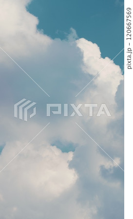 Dense Cumulus Clouds On A Clear Blue Sky. White Clouds In Blue Sky. Picturesque View Of Blue Sky With Fluffy Clouds. Vertical Time Lapse. 120667569