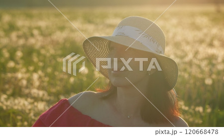 Happy Middle-Age Caucasian Woman Serene And Peaceful In Hat At Sunrise. Cheerful Happy Joyful Woman. Young Girl Wearing A Hat In A Sunset Field. Close Up. 120668478