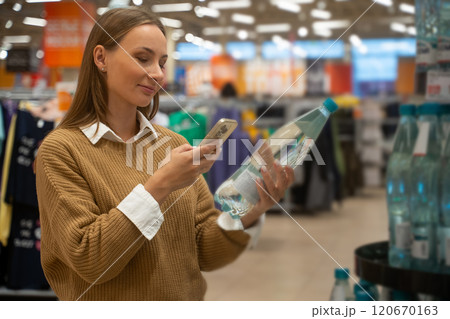 Scanning products at the supermarket for price comparisons and information Scanning products at the supermarket for price comparisons and information 120670163