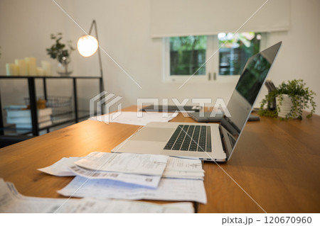 A laptop computer sitting on top of a wooden desk, portable business office desk with mockup side view computer devices on wood table, Nobody with copy space 120670960