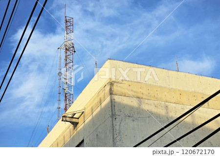 Telecom Pole on Roofs with Blue Sky. Telecom Pole on Roofs with Blue Sky. 120672170