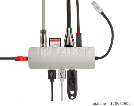 Close up of a sleek USB hub with various connected cables and devices, illustrating technology and connectivity. Close up of a sleek USB hub with various connected cables and devices, illustrating technology and connectivity. 120673603