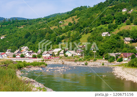 tysa river running through the valley. stones on the shore. sunny weather in summer. mountainous countryside landscape of rakhiv region in ukraine. picturesque travel destination 120675156