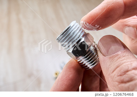 Leak seal with mounting plumbing paste before winding flax on pipe thread. 120676468