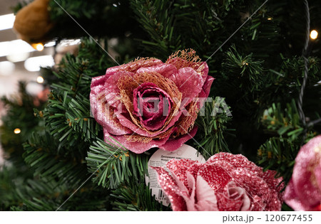 Decorative pink butterfly on a Christmas tree. 120677455