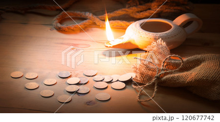 A loop made from old thick rope and coins A loop made from old thick rope and coins 120677742