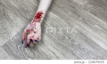 Hand of young girl has traces of vein cuts after committing suicide. Woman bloody hand shows signs of being cut with knife to end her life. Opening veins with knife and traces of blood on floor Hand of young girl has traces of vein cuts after committing suicide. Woman bloody hand shows signs of being cut with knife to end her life. Opening veins with knife and traces of blood on floor 120679429