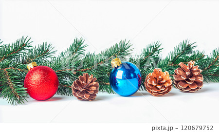 Fir twigs with colored Christmas decoration on white 120679752