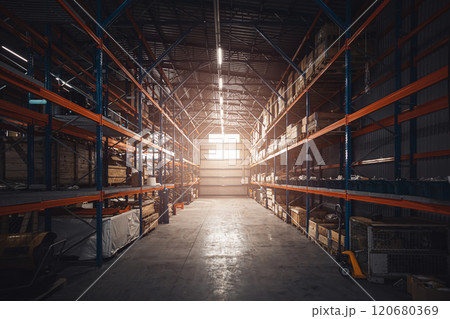 Interior of modern warehouse storage of retail shop. Large industrial warehouse. Tall racks are filled with boxes and containers. Hangar industrial and logistics companies. Shelves with variety of box 120680369