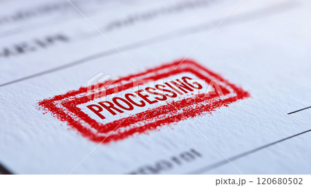 Close up of document featuring bold red PROCESSING stamp, symbolizing ongoing administrative tasks and workflows. textured paper adds depth to image 120680502