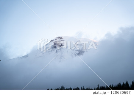 Mt. Rainier poking through the clouds amidst Mt. Rainier National Park. Mt. Rainier poking through the clouds amidst Mt. Rainier National Park. 120680697