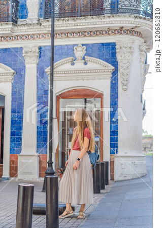 Female tourist in front of Casa de los Azulejos in Villahermosa, Mexico. Quintana Roo travel, cultural exploration, and historic architecture concept Female tourist in front of Casa de los Azulejos in Villahermosa, Mexico. Quintana Roo travel, cultural exploration, and historic architecture concept 120681810