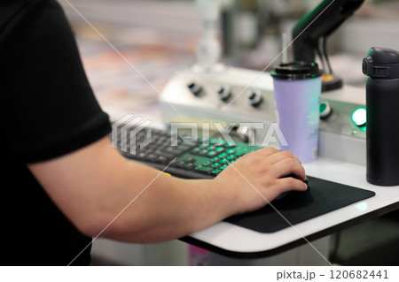 operator controls modern computerized equipment 120682441