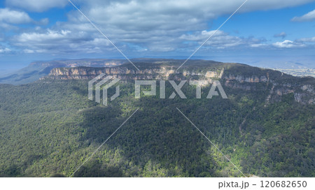 Large rock formations along a valley ridgeline 120682650