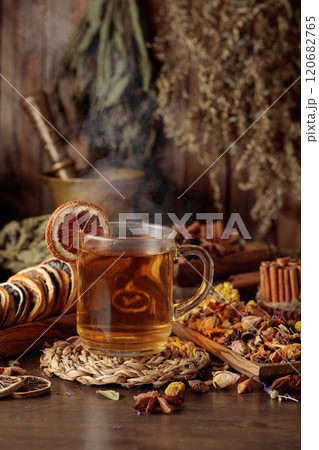 Cup of herbal tea with various dried herbs, flowers, and spices. Cup of herbal tea with various dried herbs, flowers, and spices. 120682765