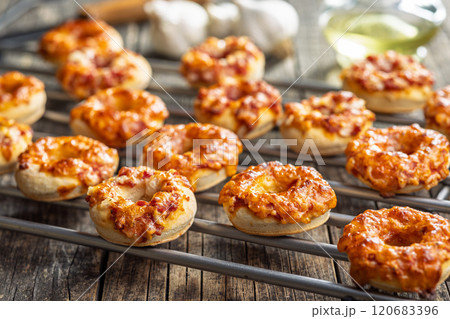 Mini pizza bagels on wooden table. Mini pizza bagels on wooden table. 120683396