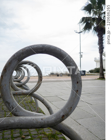 Bicycle parking. infrastructure in the park. Place for bicycles. Empty. Unusual angle. Bicycle parking Bicycle parking. infrastructure in the park. Place for bicycles. Empty. Unusual angle. Bicycle parking 120686265