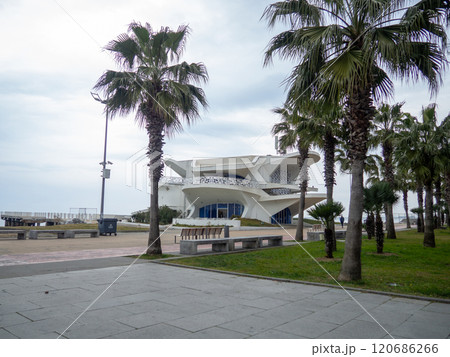 The building of unusual architecture on the seashore. Non-working restaurant. resort in winter. Park in Batumi. House on the Black Sea coast. Concrete building. The building of unusual architecture on the seashore. Non-working restaurant. resort in winter. Park in Batumi. House on the Black Sea coast. Concrete building. 120686266