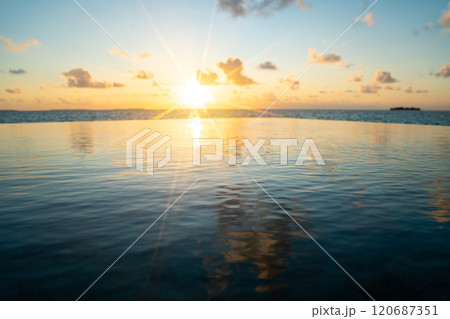 Sunset views from overwater pool villa in Maldives Sunset views from overwater pool villa in Maldives 120687351