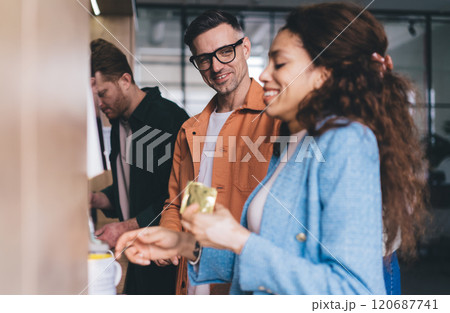 Cheerful colleagues in office together 120687741