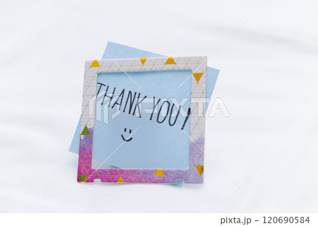 Business thank you note in a minimalist setting personal gesture office environment close-up view gratitude concept Business thank you note in a minimalist setting personal gesture office environment close-up view gratitude concept 120690584