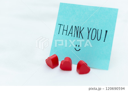 Thank you note with heart decorations home office greeting card calm environment close-up view business appreciation concept Thank you note with heart decorations home office greeting card calm environment close-up view business appreciation concept 120690594
