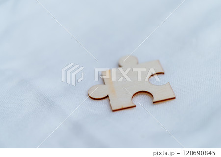 Solving business challenges a single puzzle piece on white background abstract concept minimalistic setting close-up view Solving business challenges a single puzzle piece on white background abstract concept minimalistic setting close-up view 120690845