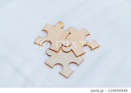 Business puzzle solving event creative workspace wooden pieces collaborative environment close-up viewpoint team dynamics Business puzzle solving event creative workspace wooden pieces collaborative environment close-up viewpoint team dynamics 120690846