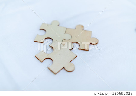 Business strategy puzzle pieces office workspace conceptual image creative environment close-up view collaboration ideas for success 120691025