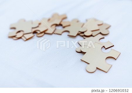 Puzzle pieces symbolizing business strategy creative workspace visual content minimalist environment close-up perspective conceptual thinking 120691032