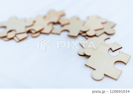 Strategic business puzzle solving collaborative workshop office space creative engagement teamwork top-down perspective problem-solving dynamics 120691034