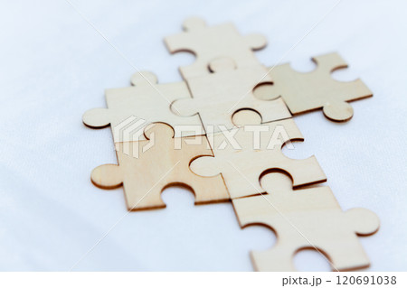 Strategic business puzzle solving office workspace conceptual image collaborative environment close-up view problem-solving concept Strategic business puzzle solving office workspace conceptual image collaborative environment close-up view problem-solving concept 120691038