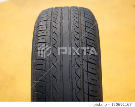 Inspecting tire quality automotive workshop product photography industrial setting close-up safety awareness Inspecting tire quality automotive workshop product photography industrial setting close-up safety awareness 120691167