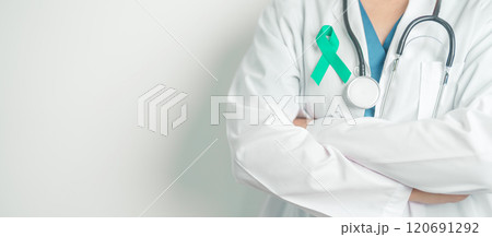 Doctor holding Teal Ribbon for January Cervical Cancer Awareness month. Uterus and Ovaries, Cervix, Endometriosis, Hysterectomy, Uterine fibroids, Reproductive, Healthcare and World cancer day 120691292