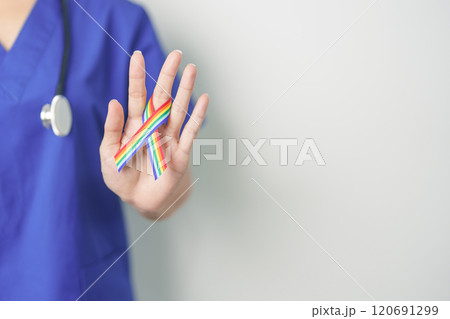 Doctor with LGBTQ Rainbow ribbon for Support Lesbian, Gay, Bisexual, Transgender and Queer community and happy Pride month concept Doctor with LGBTQ Rainbow ribbon for Support Lesbian, Gay, Bisexual, Transgender and Queer community and happy Pride month concept 120691299
