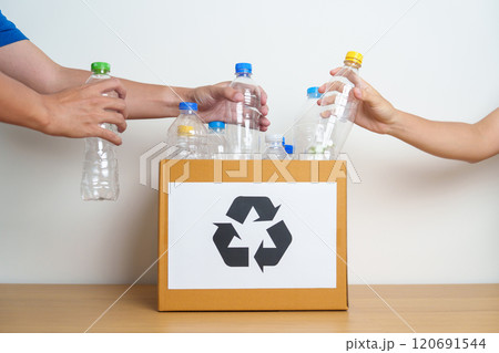 Volunteer keep plastic bottle into paper box at home or office. Hand Sorting Recycle garbage. Ecology, Environmental, pollution, Dispose recycling, waste management and trash Separation concept Volunteer keep plastic bottle into paper box at home or office. Hand Sorting Recycle garbage. Ecology, Environmental, pollution, Dispose recycling, waste management and trash Separation concept 120691544