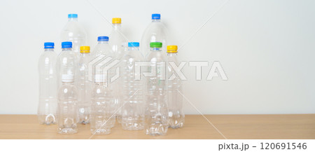 Plastic bottle on table at home or office. Recycle garbage Sorting. Plastic Free, Ecology, Environmental, pollution, Dispose recycling, waste management and trash Separation concept Plastic bottle on table at home or office. Recycle garbage Sorting. Plastic Free, Ecology, Environmental, pollution, Dispose recycling, waste management and trash Separation concept 120691546