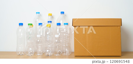 Plastic bottle in paper box at home or office. Recycle garbage Sorting. Plastic Free, Ecology, Environmental, pollution, Dispose recycling, waste management and trash Separation concept Plastic bottle in paper box at home or office. Recycle garbage Sorting. Plastic Free, Ecology, Environmental, pollution, Dispose recycling, waste management and trash Separation concept 120691548