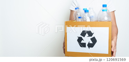 Volunteer keep plastic bottle into paper box at home or office. Hand Sorting Recycle garbage. Ecology, Environmental, pollution, Dispose recycling, waste management and trash Separation concept Volunteer keep plastic bottle into paper box at home or office. Hand Sorting Recycle garbage. Ecology, Environmental, pollution, Dispose recycling, waste management and trash Separation concept 120691569
