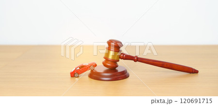 Car Law, Insurance, auto Tax, Auction and Bidding concepts. crashed small toy car models with Judges gavel on desk in courthouse. Car Law, Insurance, auto Tax, Auction and Bidding concepts. crashed small toy car models with Judges gavel on desk in courthouse. 120691715
