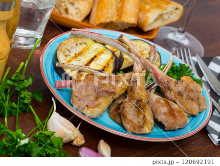 Lamb ribs with aubergine and herbs Lamb ribs with aubergine and herbs 120692191