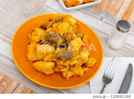 Portion of braised potatoes with beef Portion of braised potatoes with beef 120692198