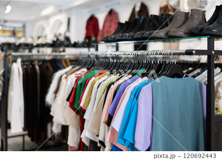 Colorful array of female clothes shoes in shop display, creating vibrant window in clothing store 120692443