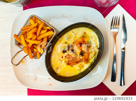 Popular dish of French cuisine is the escalope Savoyard 120692833